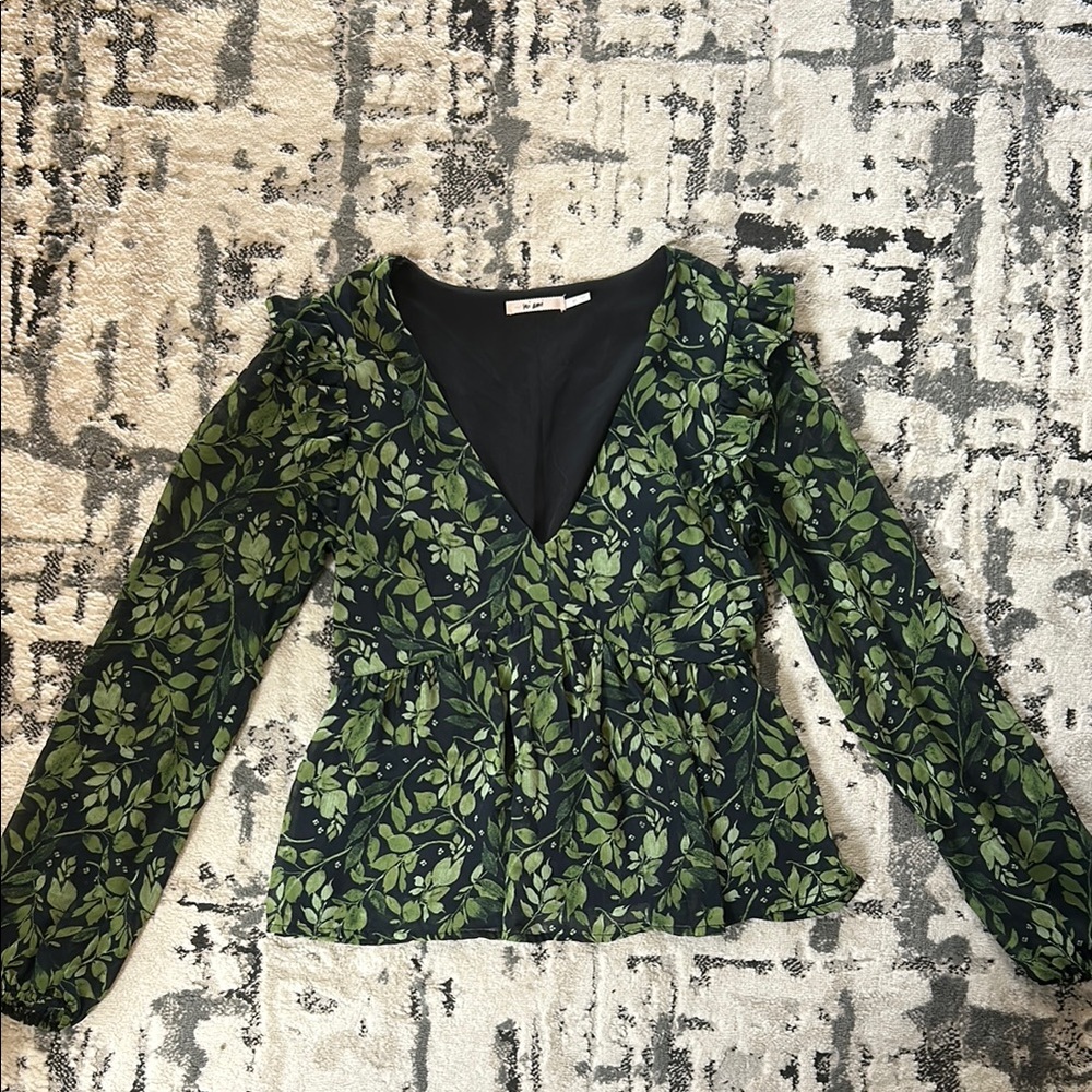 Green and black v-neck peplum top